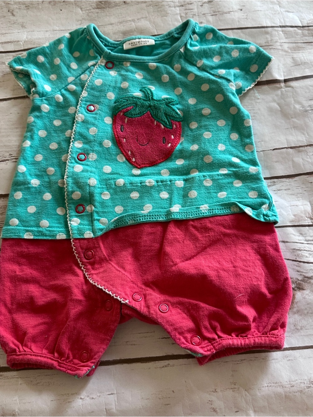 Next strawberry romper with a strawberry appliqué vguc 0/3